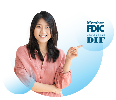 Image of a smiling woman who is pointing to the FDIC and DIF logos